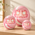 pink daruma three sizes styled