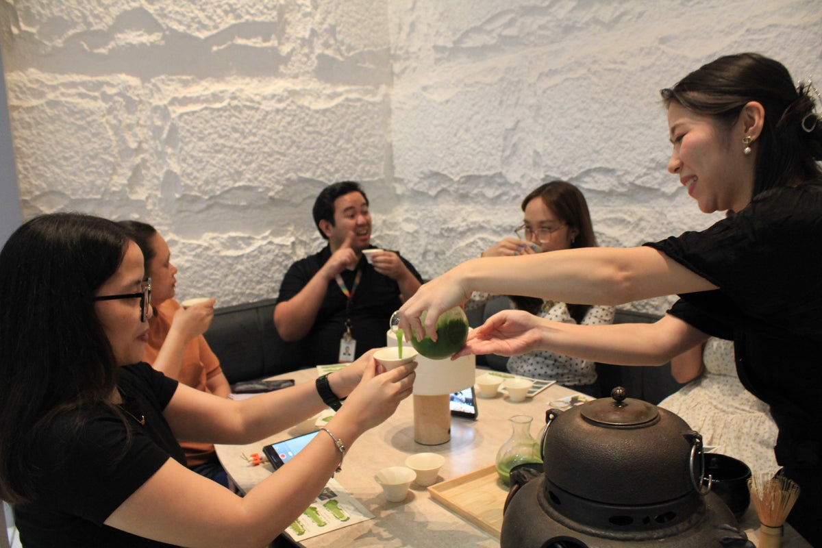 A Chotto Matcha host pours matcha for workshop guests